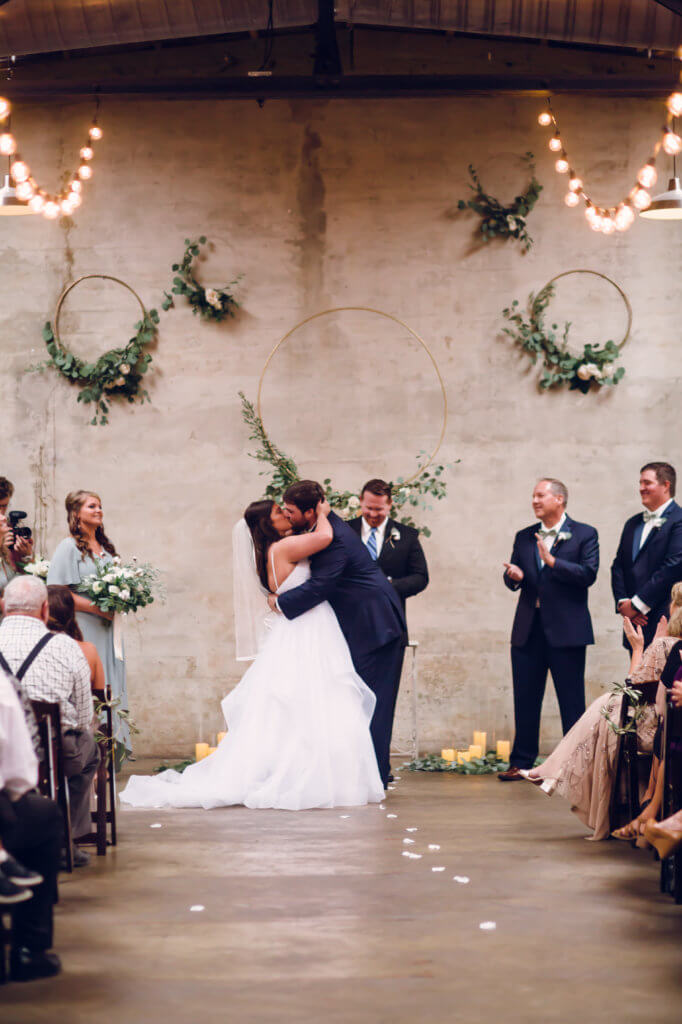 Bride and groom kissing at The Standard Knoxville