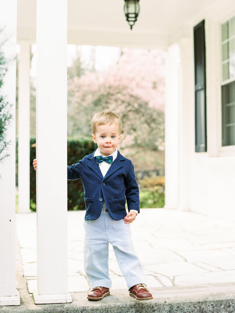 Boy on porch of home in historic Knoxville tn neighborhood